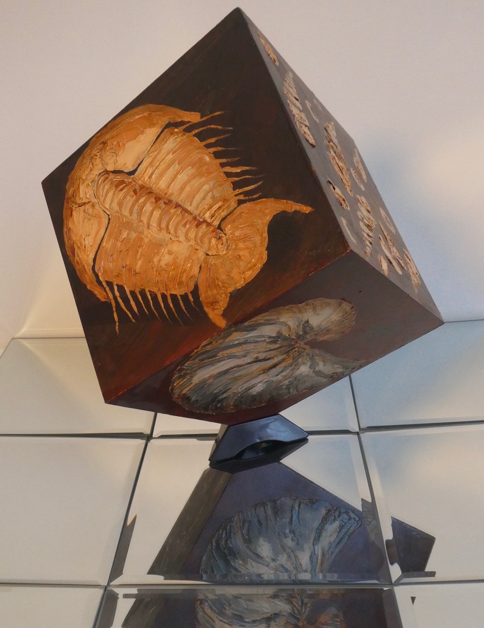 Fossils, oil paint on wooden cube, by Sally Dillon