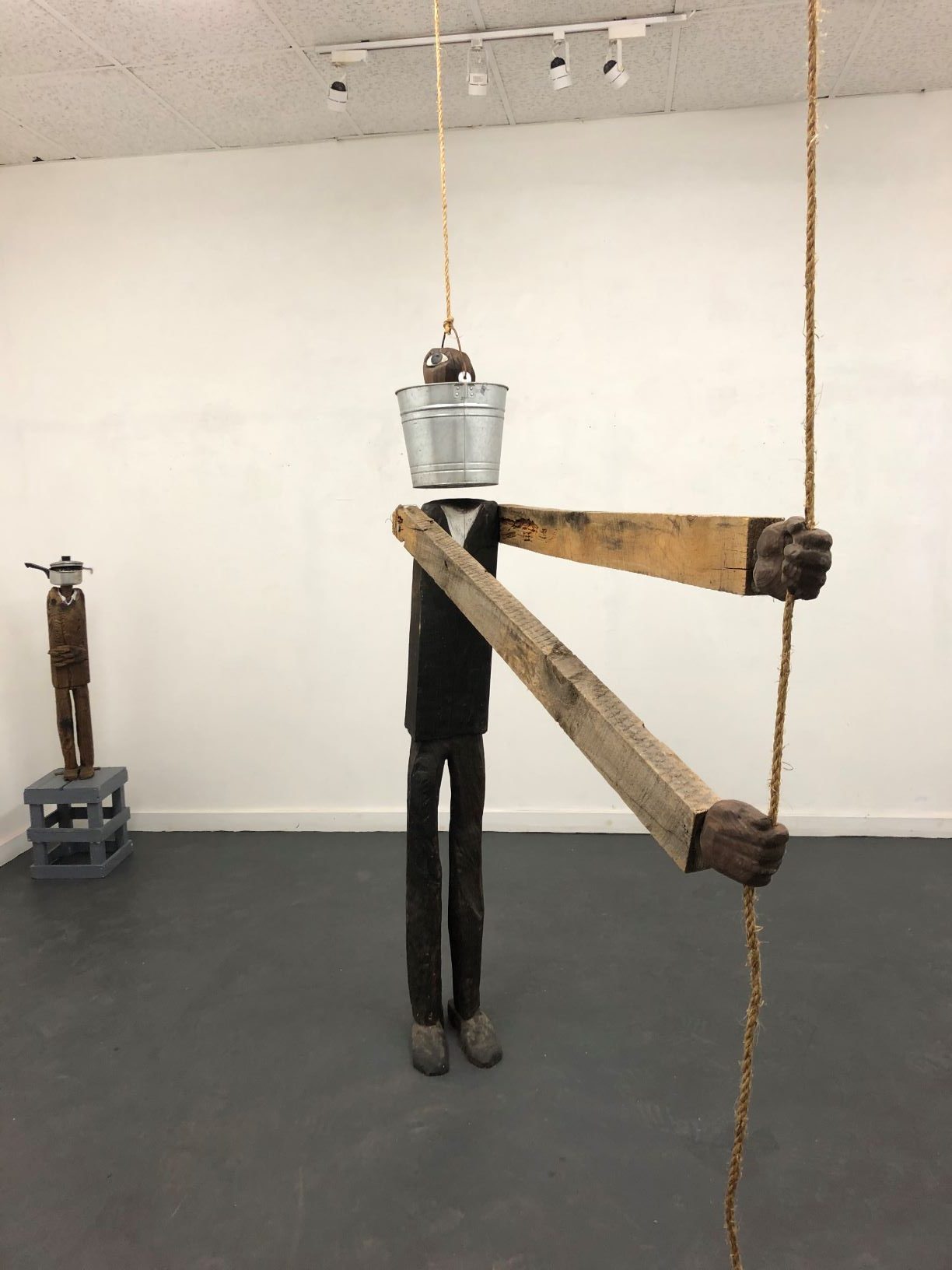 Jack, Wood and rope and pail and water, by Michael Tillyer