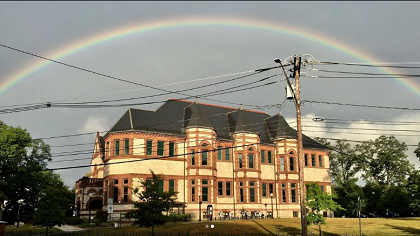 photo of the west facade ofForbes Library with a rainbow over it