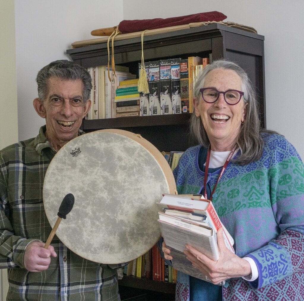 Homebound Delivery Service patron receives books and instruments from his dedicated volunteer.