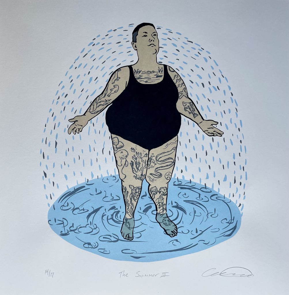 A woman in a black swimsuit stands inside a dome of water droplets. Her body is covered with tattoos of aquatic life, down to her feet which stand in a circle of water. 